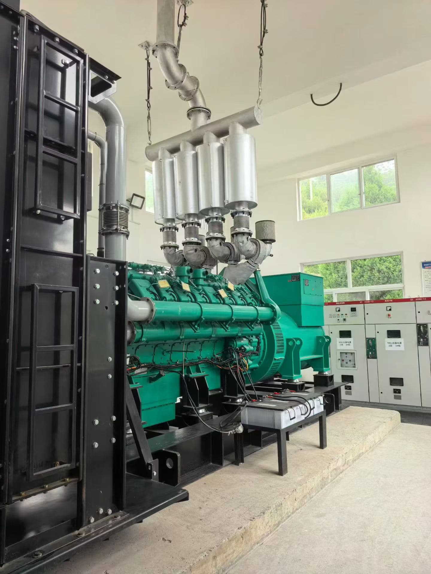 The same high-voltage set from the other side, showing the exhaust manifold, radiator and switchgear line-up