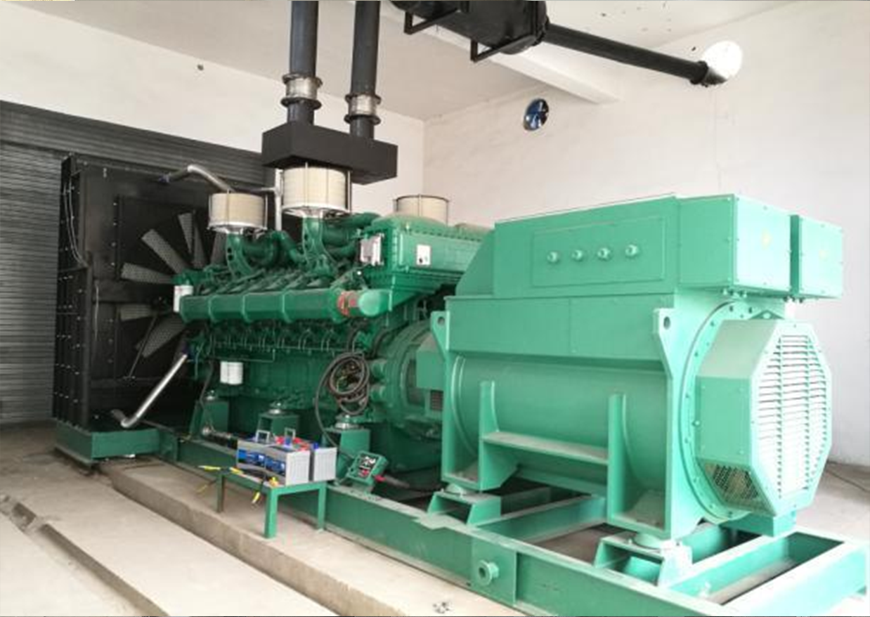 A green 1800 kW genset on a concrete plinth in a plant room, with exhaust ducts rising to the ceiling